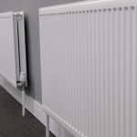 Row of panel radiators with thermostatic radiator valves
