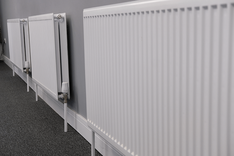 Row of panel radiators with thermostatic radiator valves